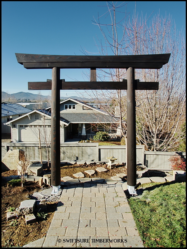 This Torii gate serves as the entrance to a memorial garden for the 